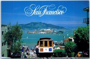 A cable car climbs the steep Hyde Street hill - San Francisco, California