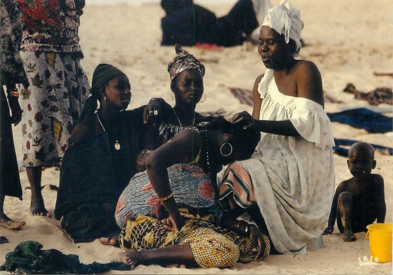 Postcard African ethnic types and scenes village hairdresser