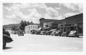 H71/ Spearfish South Dakota Postcard RPPC c40s Stores Automobiles 117