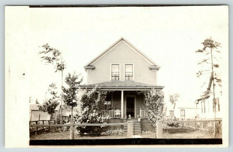 Marble MN~2-Story Home~Barbed-Wire Fence~Dog & Girl on Porch~Hammock RPPC c1910