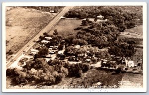 K46/ Palmetto Florida RPPC Postcard c1940s Camp Tropical Cabins Trailer 154