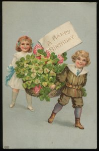 A Happy Birthday. 2 Victorian children & basket of shamrocks. E.A. Schwerdtfeger