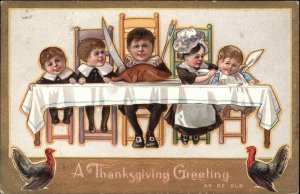 Thanksgiving Children Turkey Dinner Gilt Embossed c1910s Postcard