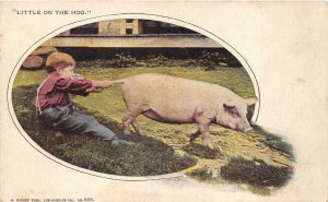 LITTLE ON THE HOG BOY PULLING PIGS TAIL COMIC POSTCARD (c. 1905)