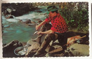 P3237 vintage postcard a fishermen cleans his catch dubreuilville ontario canada