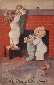 Christmas - Cute Kids Taking Down Their Stockings EHS c1910 Postcard