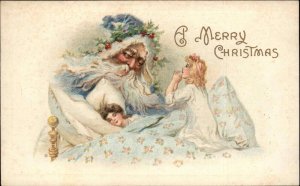 Christmas Santa claus in Blue Robe Watches Over Little Girls c1910 Postcard