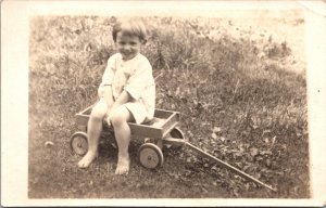 Real Photo Postcard Sweet Little Boy Sitting in a Wagon