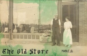 Hand-Colored RPPC The Old Store, Red Wing Shoes & Clothing, Mable D. Unknown US