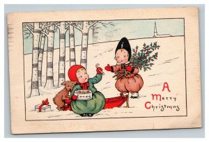 Vintage 1916 Christmas Postcard Cute Children Sled Eating Candy Mistletoe