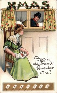 Christmas Pretty Woman Reading Man Embossed BB London c1900s-20s Postcard