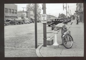 REAL PHOTO GRUNDY CENTER IOWA DOWNTOWN STREET SCENE BICYCLE POSTARD COPY