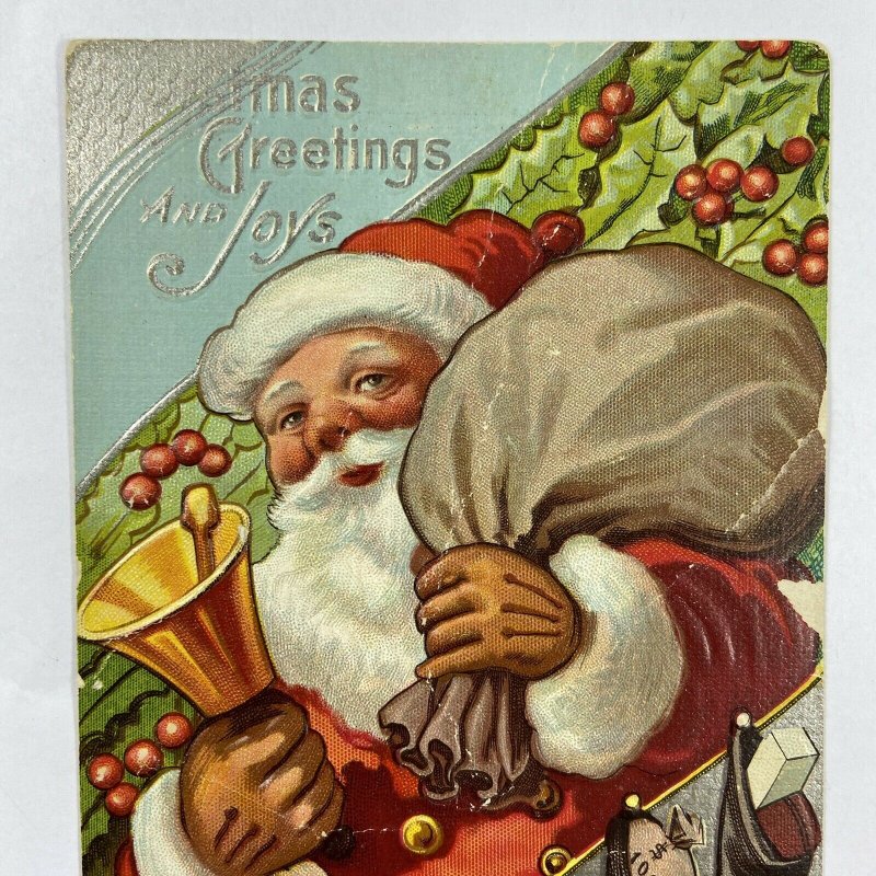 c.1915 Old Santa Claus Bell Toys Sack Bag Stockings Embossed Christmas Postcard