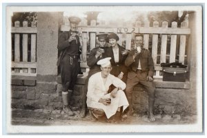 Military Chef Candid Europe Fence Drinking Coffee RPPC Photo Antique Postcard