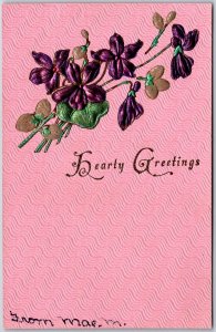 Hearty Greetings Violet Flowers To Mrs Alice E. Miles Pink Background Postcard