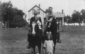 RPPC, FAMILY PICTURE  Men & Boys On Horses~Little Girl~House  1907-1929 Postcard