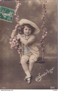 RP: Souvenir Little Boy wearing floppy hat sitting on swing, pink flower ro...