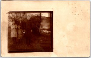 Four Children in Winter Clothes Outside for Portrait in Town - Vintage Postcard