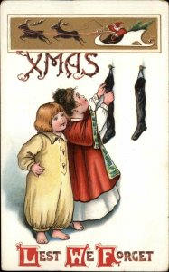 Christmas - Children Hanging Stockings Santa Claus Sleigh BB London Postcard