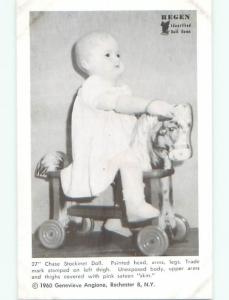 Unused 1960 postcard ANTIQUE CHASE STOCKINET DOLL ON HORSE RIDING TOY k7098