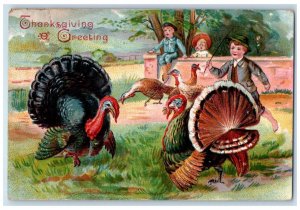 c1910's Thanksgiving Greeting Boy Playing With Turkey Embossed Antique Postcard