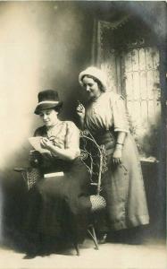 C-1910  Photo Studio Interior 2 Women reading letter RPPC Photo Postcard 4434