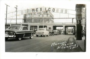 Postcard RPPC 1940s California Calexico Mexicali Mexico autos Street CA24-2962