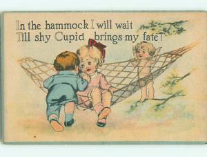 Unused Divided-Back valentine CUPID WITH KIDS ON HAMMOCK r3973