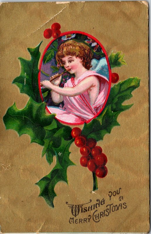 VINTAGE POSTCARD MERRY CHRISTMAS CUPID PLAYING FLUTE MAILED U.K. 1912