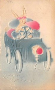EASTER HOLIDAY GREETINGS RABBITT DRIVING CAR EMBOSSED POSTCARD 1909