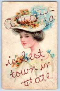 Atlantic Iowa Postcard Town Woman Hat Flower Glitter 1910 Vintage Antique Posted