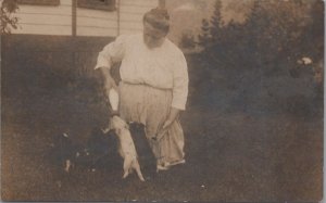 RPPC Postcard Woman Bottle Feeding Baby Pigs Piglets Foxburg PA