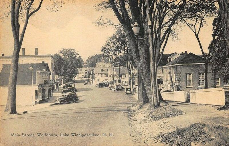 Wolfeboro NH Lake Winnipesaukee Main Street Storefronts Old Cars Postcard.