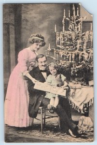 c1910's Christmas Family Child Girl Holding Book Toy Posted Antique Postcard