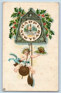 New Year Postcard Little Boy Ringing Clock Holly Berries Embossed c1910's