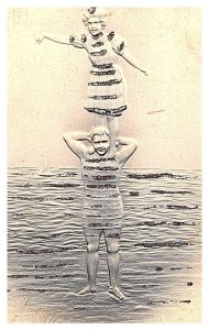 Couple at beach, Standing on Shoulder