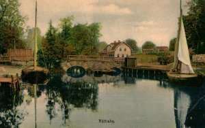 VINTAGE POSTCARD RIVER SCENE WITH BOAT BRIDGE AND HOUSE NATTRABY SWEDEN 1920