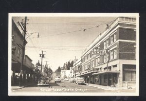 RPPC TOLEDO OREGON DOWNTOWN STREET SCENE OLD CARS REAL PHOTO POSTCARD 