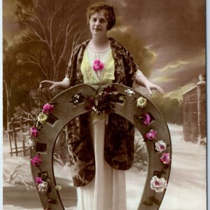 c1900s France RPPC Woman Floral Horseshoe Winter Backdrop Hand Colored Girl A347