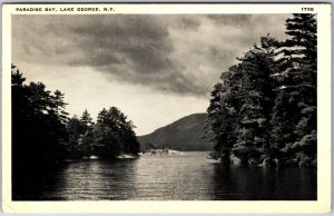 VINTAGE POSTCARD VIEW OF PARADISE BAY AT LAKE GEORGE NEW YORK SLOGAN CANCEL