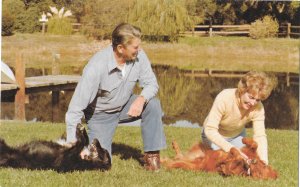 Ronald Reagon and Wife Nancy Playing with Dogs on Their California Ranch