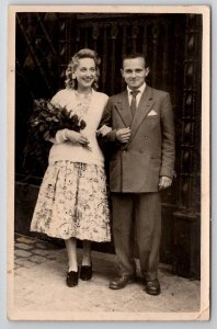 RPPC Lovely European Couple Woman with Flower Bouquet Real Photo Postcard H28