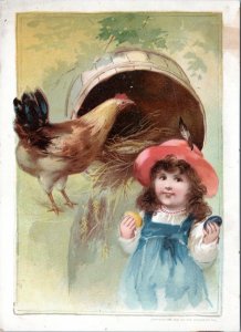 Trade Card -Woolson Spice Easter  Girl in blue dress holding eggs of chicken