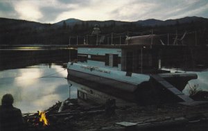 Houseboat docked as dusk falls, Waterway Houseboats Ltd., Sicamous, B.C. 40s-60s