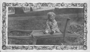 Artsy Border Frame Child Wheelbarrow C-1910 RPPC Photo Postcard 21-2839