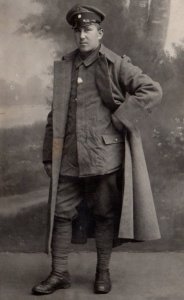 RPPC WWI German Army Soldier In Trench Coat Real Photo Postcard