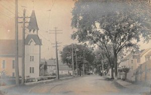 RPPC TOWN STREET SCENE CHURCH REAL PHOTO POSTCARD (c. 1910)