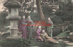 Japan, Geisha Girls in Ethnic Costume Hanging Out in Garden