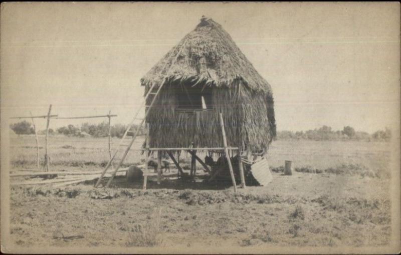 One Room Flat - Manila Written on Back Thatch Hut Phillipines c1910 RPPC