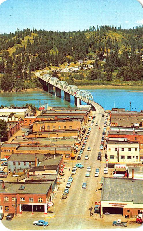 Bonners Ferry ID Main Street Gas Station Aerial View Bridge Old Cars Postcard